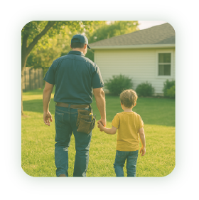 Technician holding his son's hand in the backyard